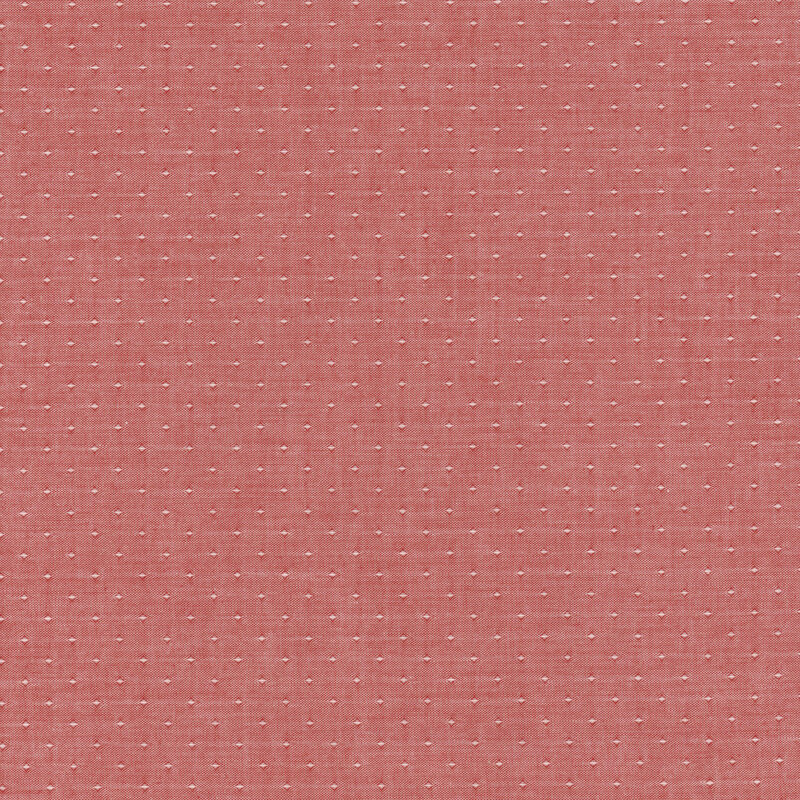 Muted red woven fabric with dot accents woven into it