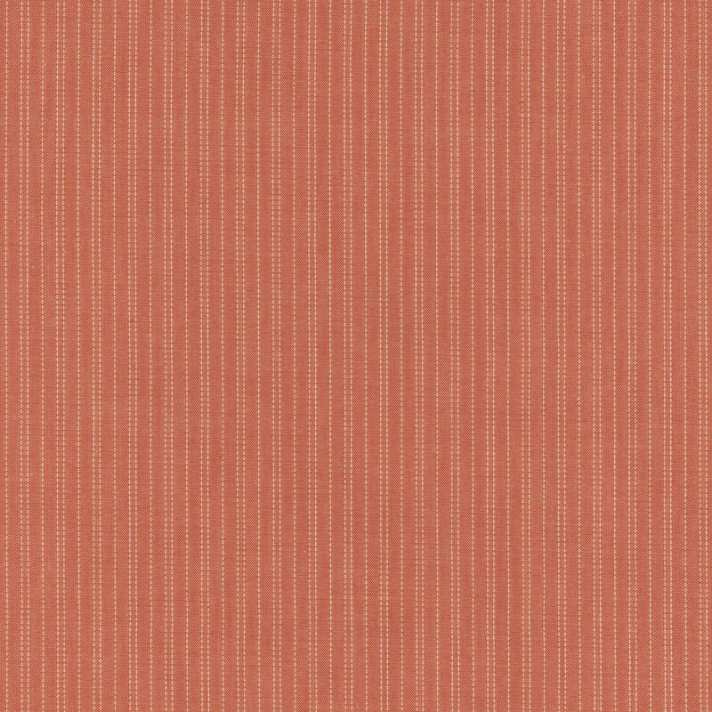 Red-orange fabric with white stitched pinstripes