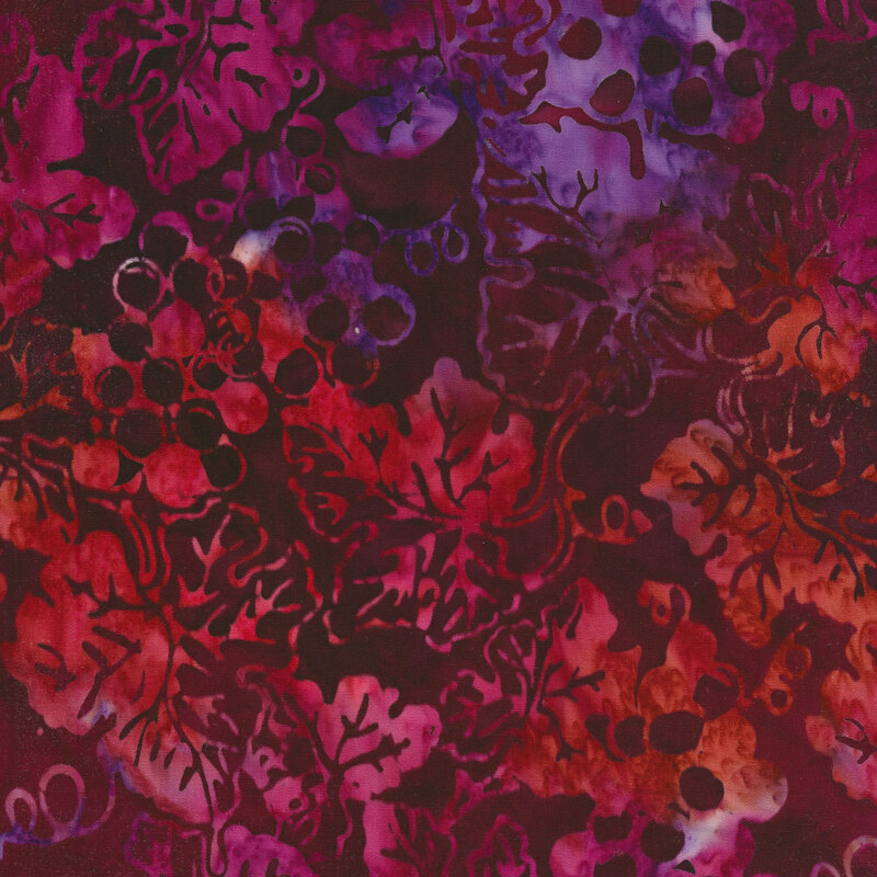 Deep crimson mottled fabric with a pattern of creeping mottled red and purple grape vines.