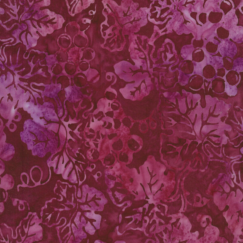 Mottled berry-colored fabric with a pattern of creeping mottled magenta and purple grape vines.