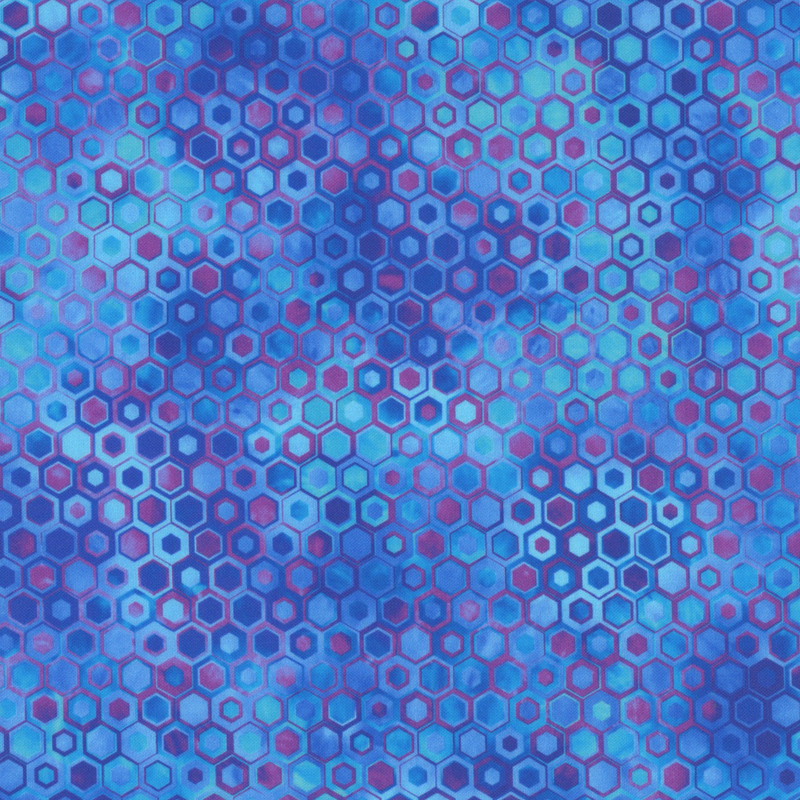 beautifully mottled geometric fabric featuring a honeycomb pattern filled with nestled hexagons in varied shades of vibrant blue, cyan, and purple