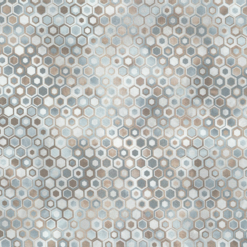 beautifully mottled geometric fabric featuring a honeycomb pattern filled with nestled hexagons in varied shades of gray, off white, and brown