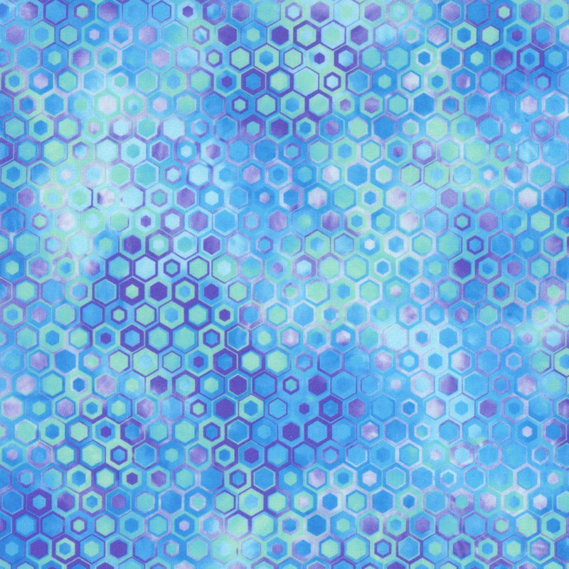 beautifully mottled geometric fabric featuring a honeycomb pattern filled with nestled hexagons in varied shades of vibrant blue, aqua, and purple