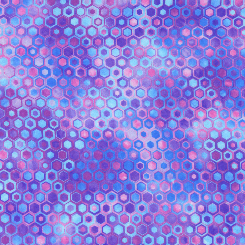 beautifully mottled geometric fabric featuring a honeycomb pattern filled with nestled hexagons in varied shades of vibrant blue, purple, and pink