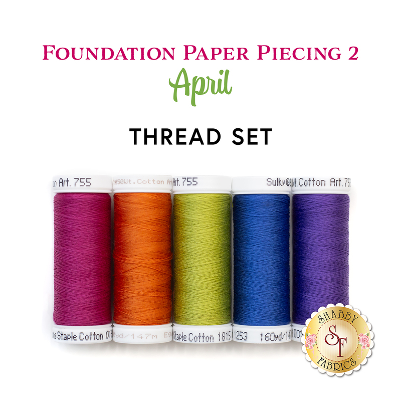 5 spools of thread against a white background including plum, orange, green, blue, and purple