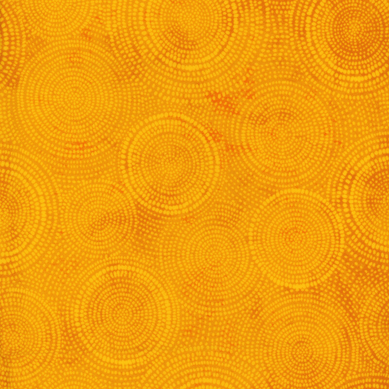 Photo of bright yellow mottled fabric with pale tonal rings made up of tiny dashes
