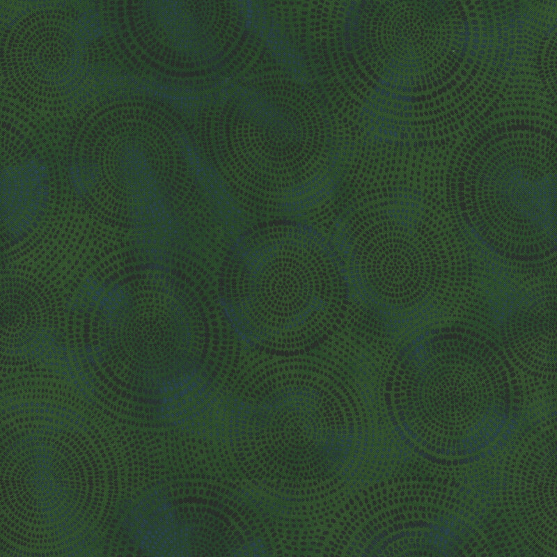 Photo of green and teal mottled fabric with dark tonal rings made up of tiny dashes