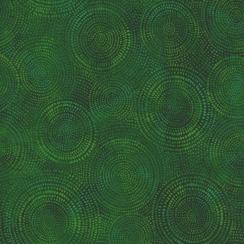 Photo of green mottled fabric with pale tonal rings made up of tiny dashes