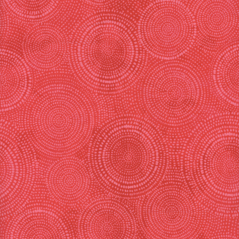 Photo of bright pink mottled fabric with pale tonal rings made up of tiny dashes