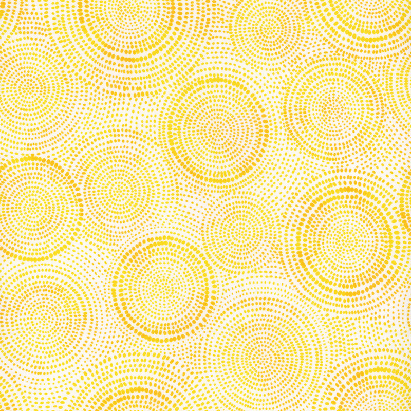 Photo of light yellow mottled fabric with darker tonal rings made up of tiny dashes