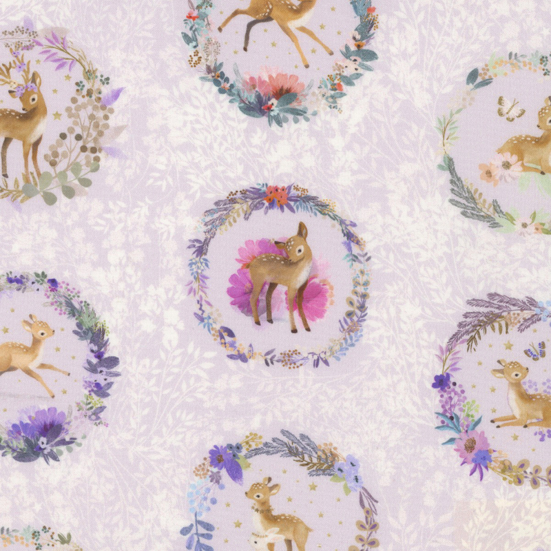 lovely pastel purple fabric with white background wildflowers and alternating rows of adorable deer portraits in flower wreath frames