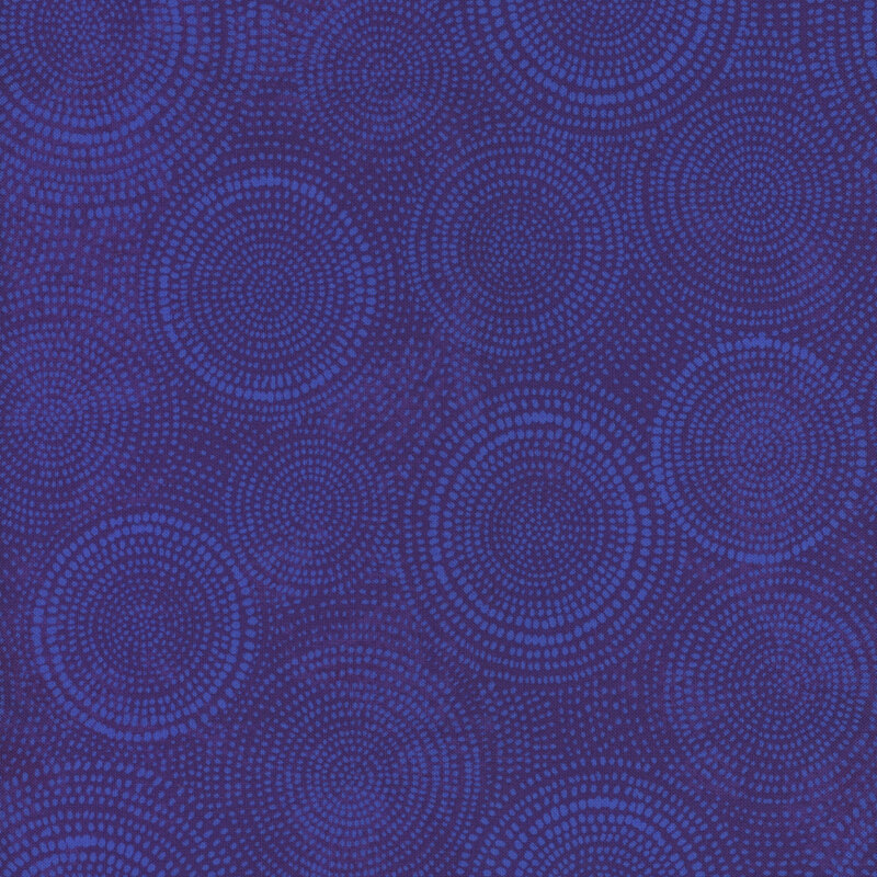 Photo of royal blue mottled fabric with lighter tonal rings made up of tiny dashes