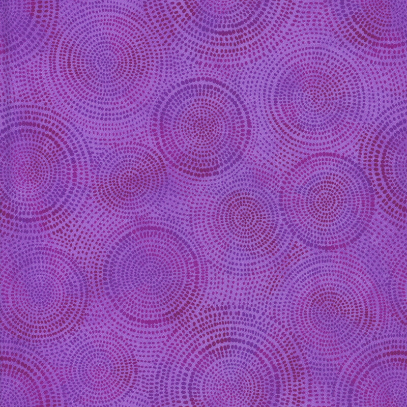 Photo of purple mottled fabric with darker tonal rings made up of tiny dashes