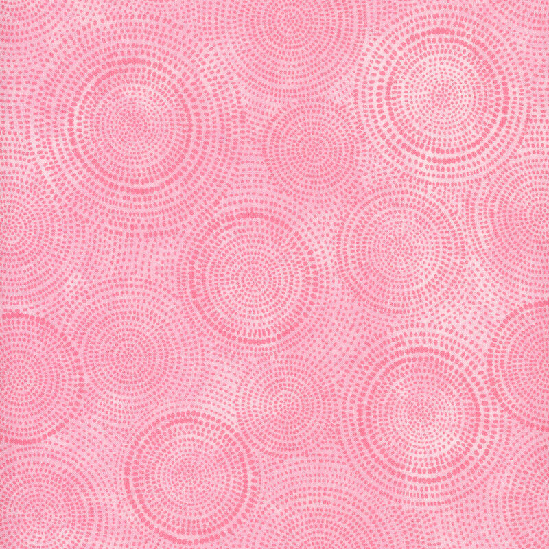 Photo of light pink mottled fabric with darker tonal rings made up of tiny dashes
