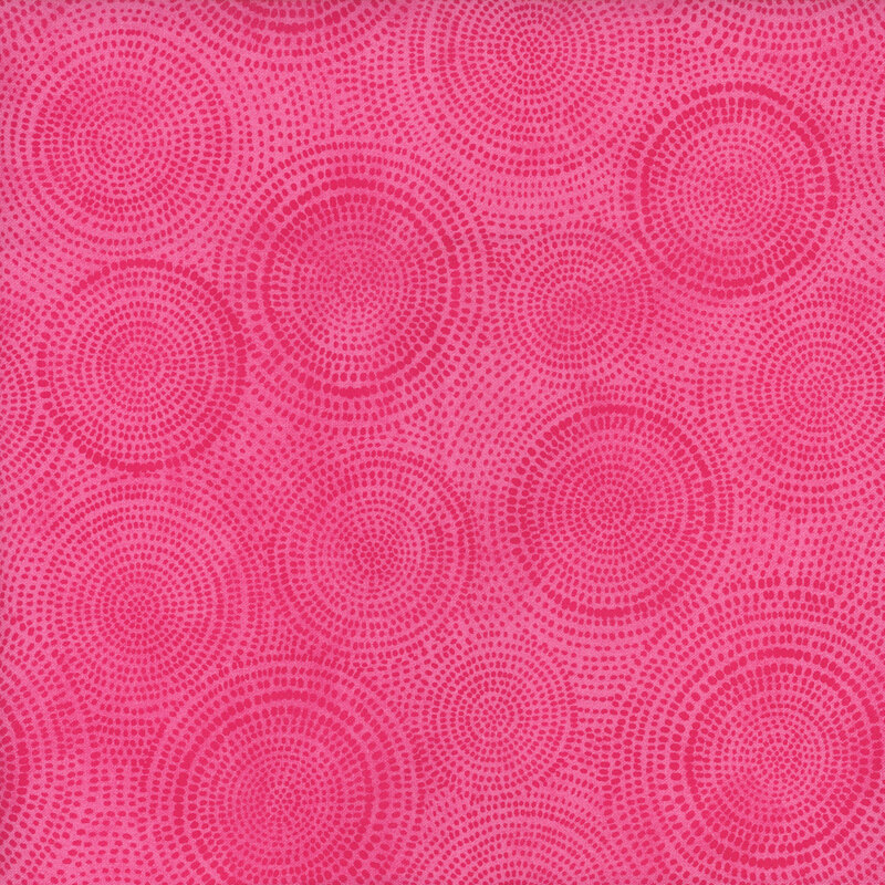 Photo of bright pink mottled fabric with darker tonal rings made up of tiny dashes