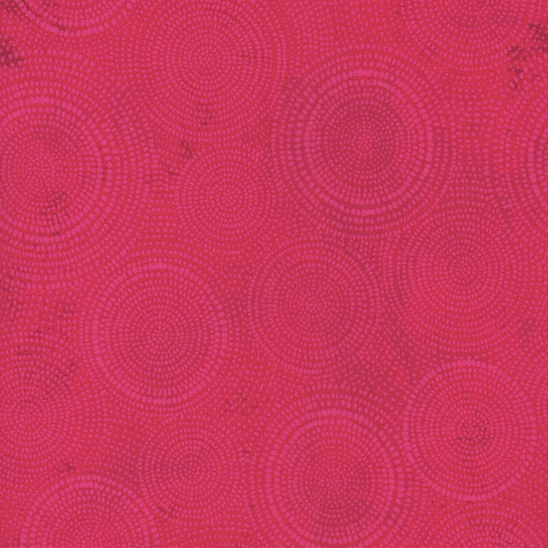 Photo of bright magenta mottled fabric with lighter tonal rings made up of tiny dashes