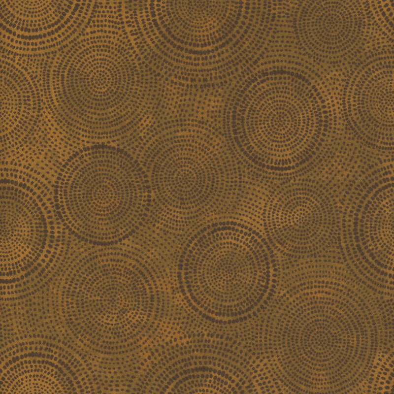 Photo of brown mottled fabric with darker tonal rings made up of tiny dashes