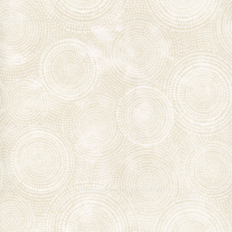 Photo of cream mottled fabric with lighter tonal rings made up of tiny dashes