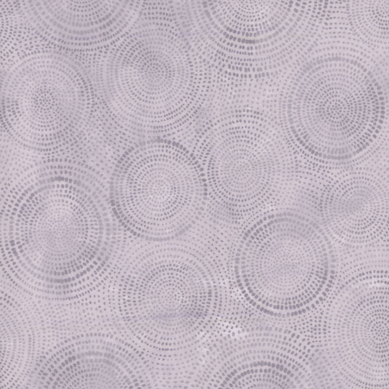 Photo of gray fabric with darker tonal rings made up of tiny dashes