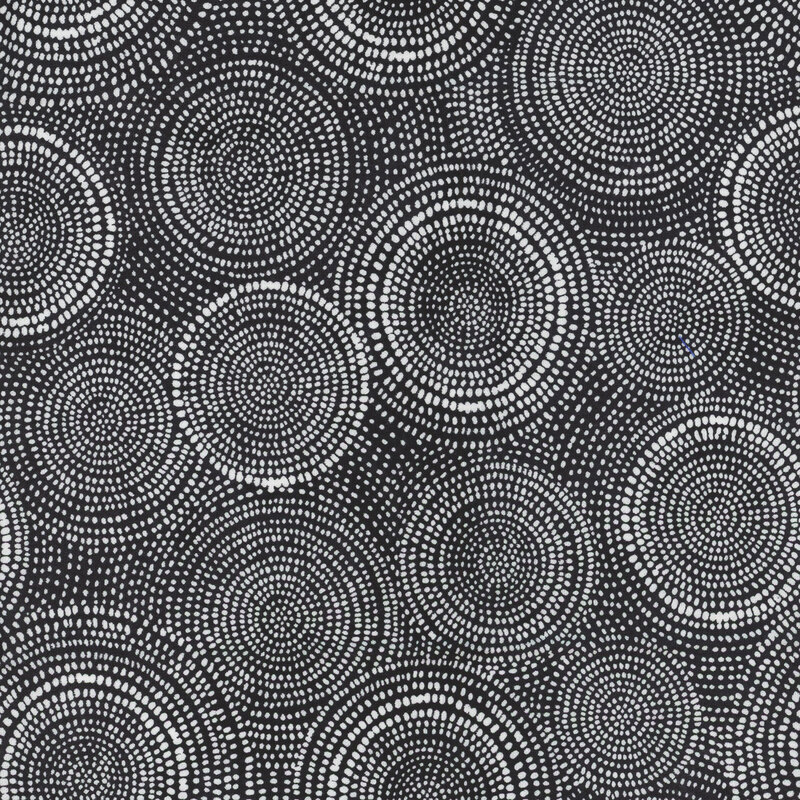 Photo of black fabric with white rings made up of tiny dashes