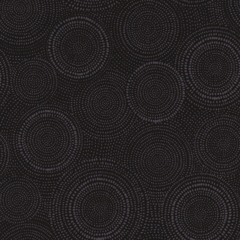 Photo of black fabric with lighter tonal rings made up of tiny dashes
