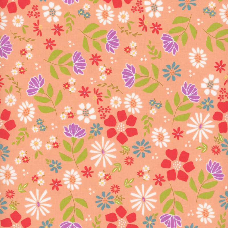 peach fabric featuring a colorful floral design
