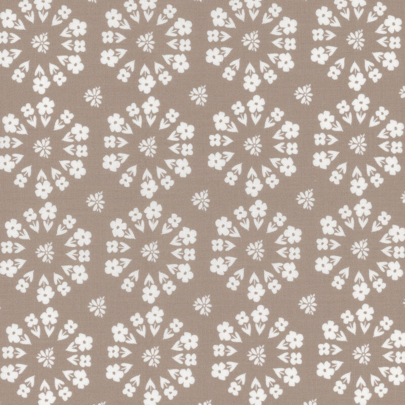 gray fabric featuring a circular design of florals