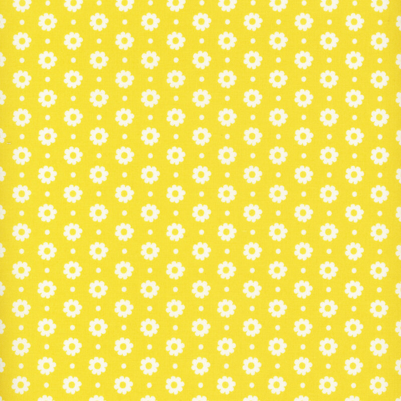 bright yellow fabric featuring white flower heads and dots