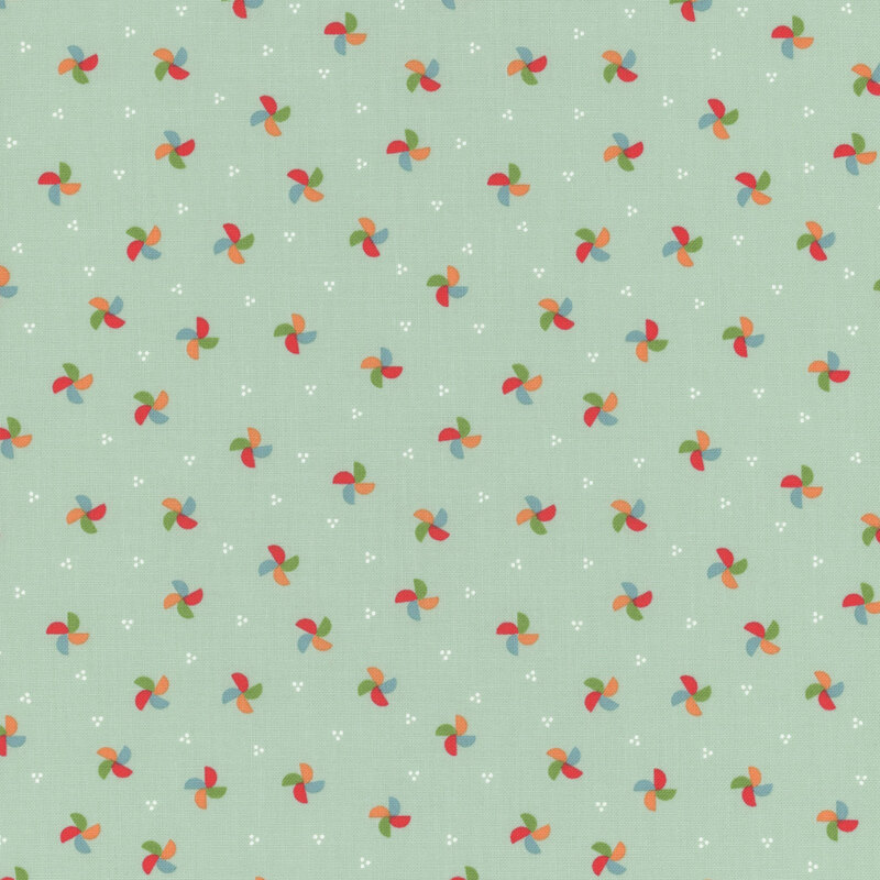 pale aqua fabric featuring multicolored pinwheels