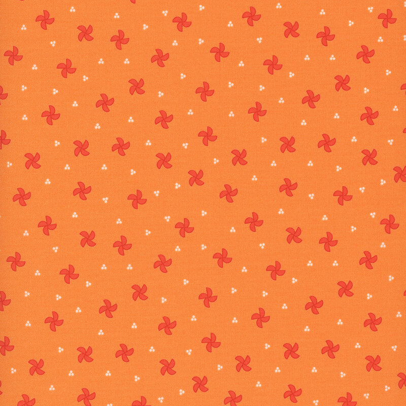 orange fabric featuring red pinwheels
