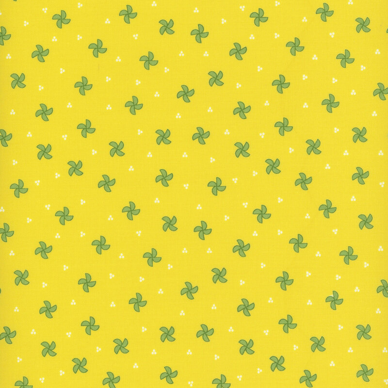 bright yellow fabric featuring green pinwheels