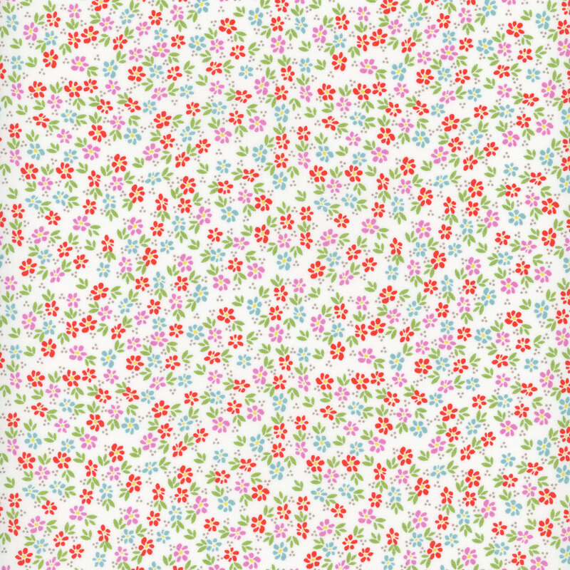 white fabric featuring packed multicolored flowers