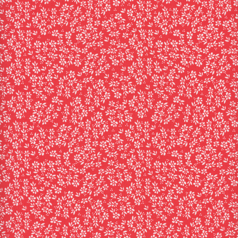 red fabric featuring tiny packed white flowers