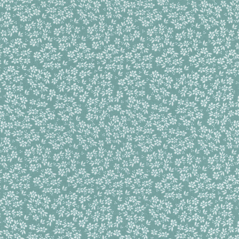 aqua fabric featuring packed white flowers