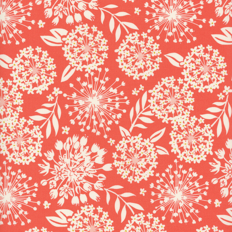 A red colored fabric with cream colored silhouettes of flowers and leaves.