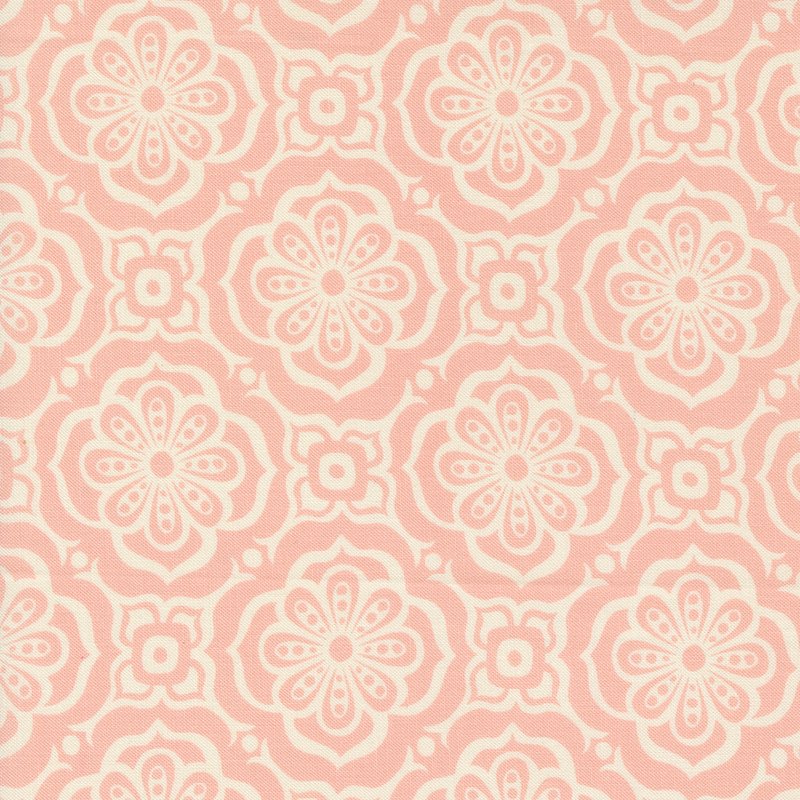 An image of a pink colored fabric with a cream colored floral tile pattern.