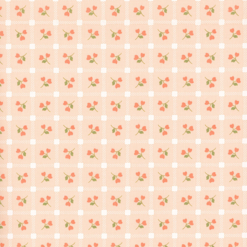 Pink fabric with a pattern of pink floral sprigs in a white grid.