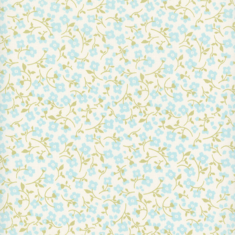 White fabric with a packed pattern of blue floral sprigs.