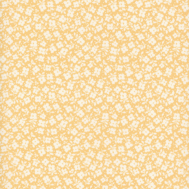 Yellow fabric with a packed pattern of white flowers and leaves.