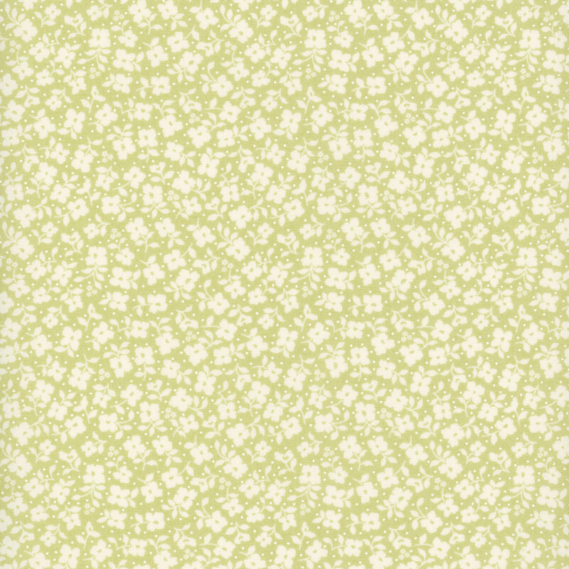 Sage green fabric with a packed pattern of white flowers and leaves.