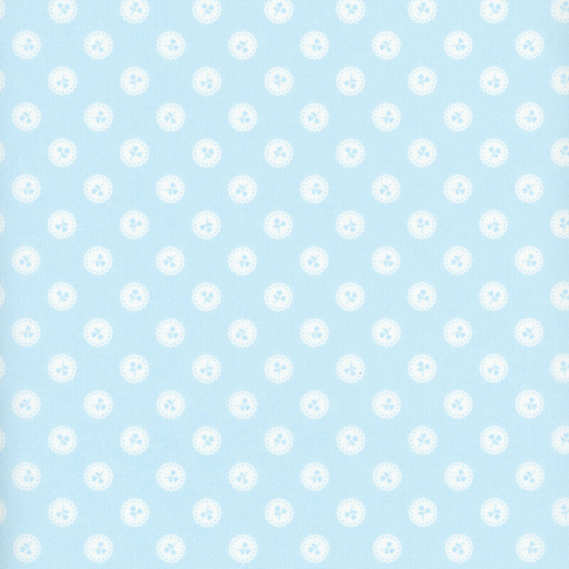 Light blue fabric with a pattern of light blue floral sprigs in white buttons.