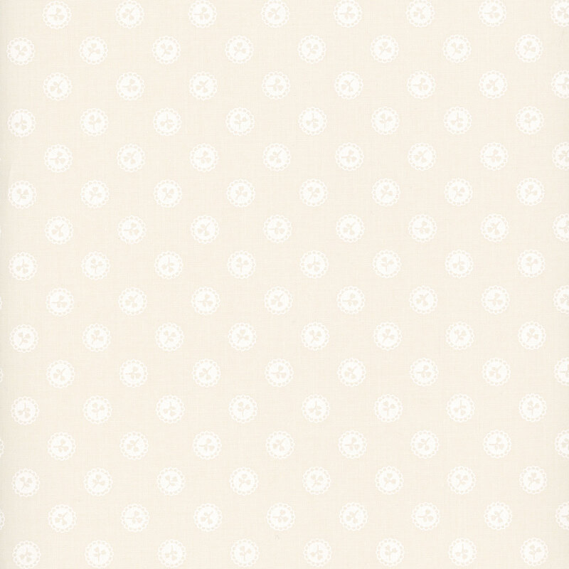 Off-white fabric with a pattern of cream-colored floral sprigs in white buttons