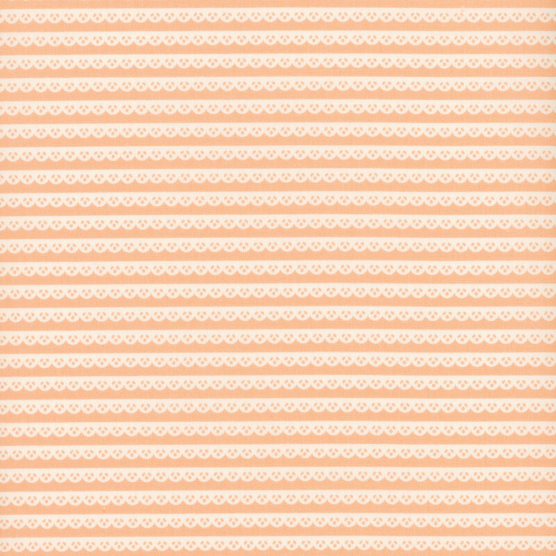 Pink fabric with a pattern of white scallop lace stripes.