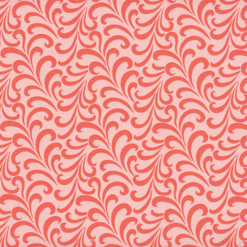 Pink fabric with an abstract pattern of salmon swirls.