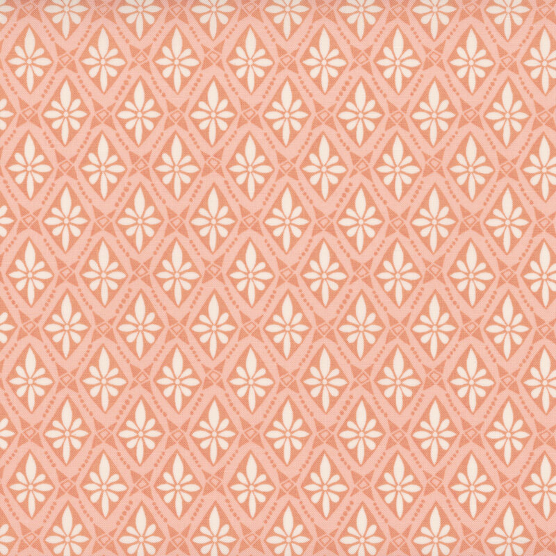 A pink colored fabric with a cream colored floral tile pattern.