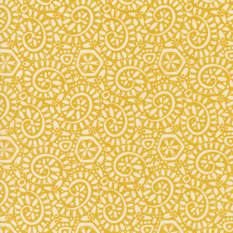 Yellow fabric with a packed pattern of cream-colored ammonite swirls and dots.