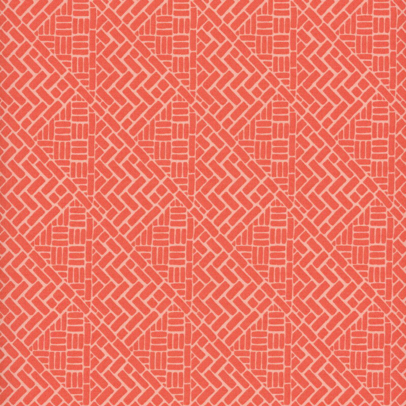 Red salmon fabric with a brick wall design in a woven pattern.