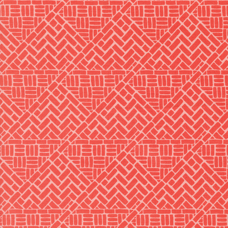 Red salmon fabric with a brick wall design in a woven pattern.