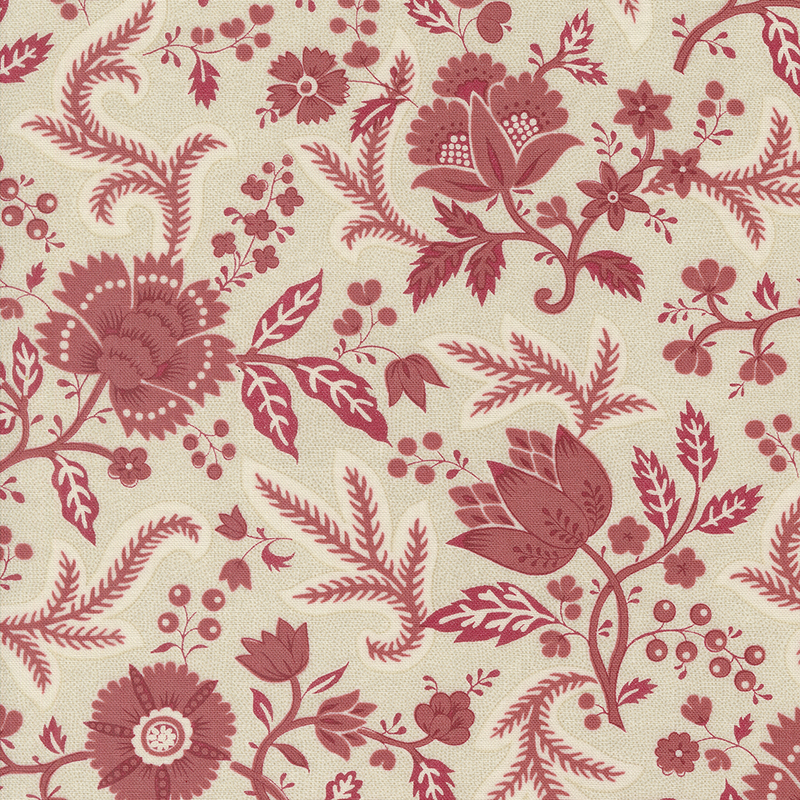 Cream fabric featuring a red floral design with leaves and vines