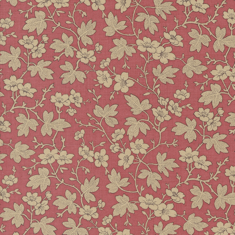 Pink fabric featuring cream leaves and flowers